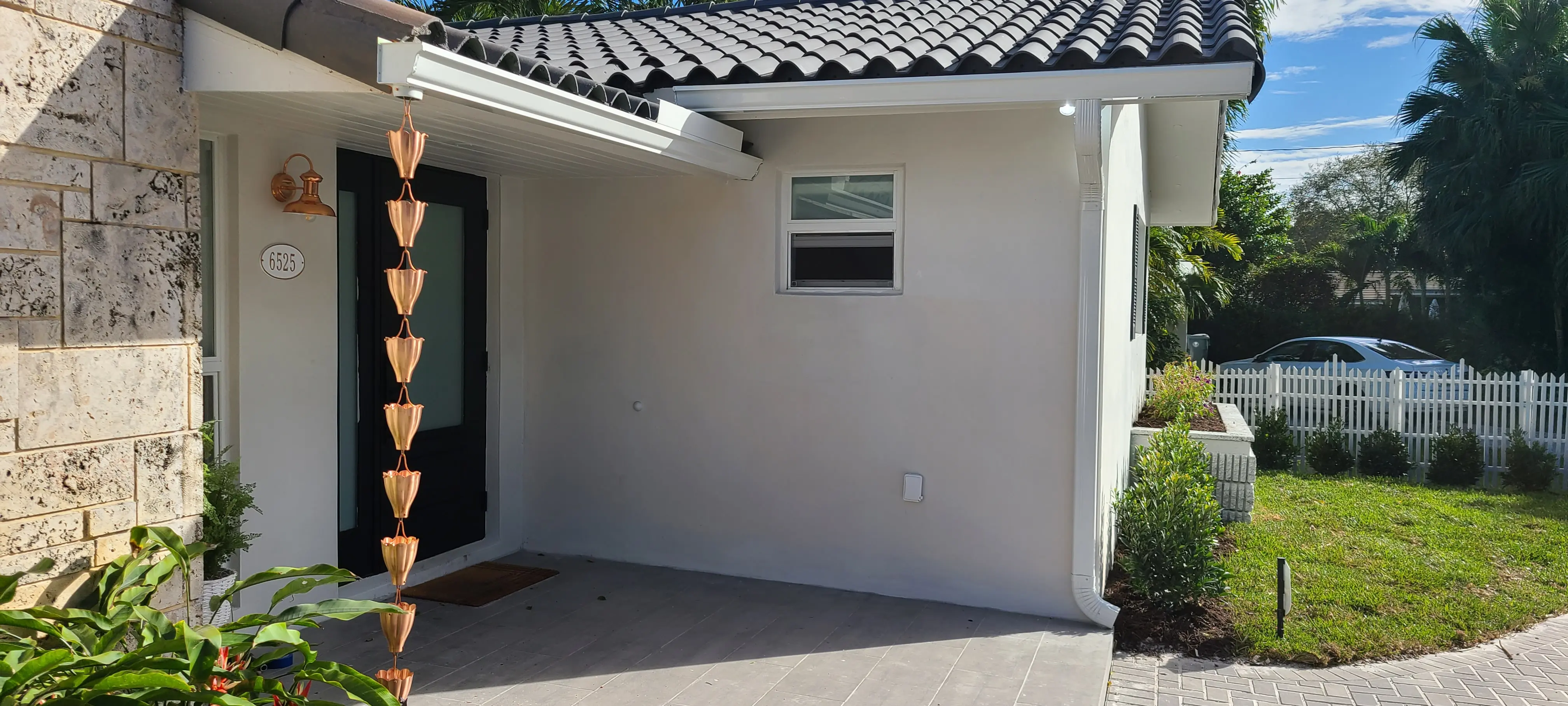 Infinity rain gutters and security cameras